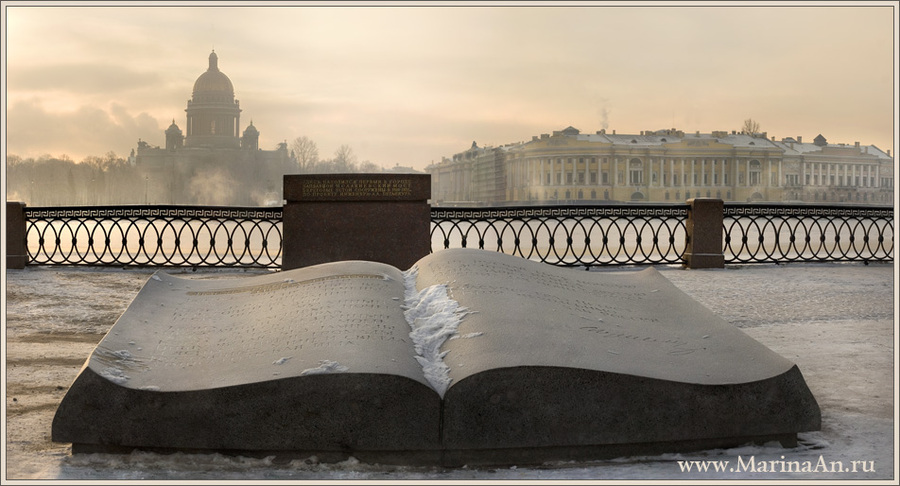 Winter landscape with a cathedral, a monument and a book of poems