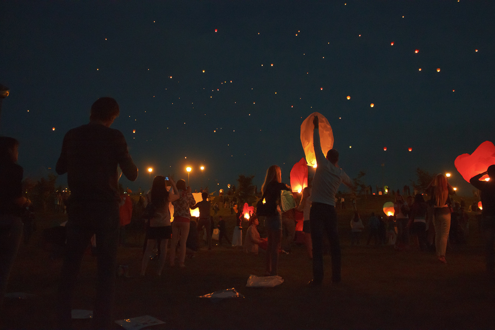 Paper lanterns in the night sky