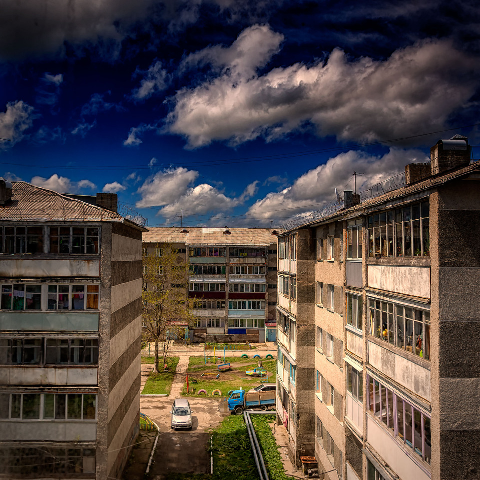 Five-storey buildings in summer day