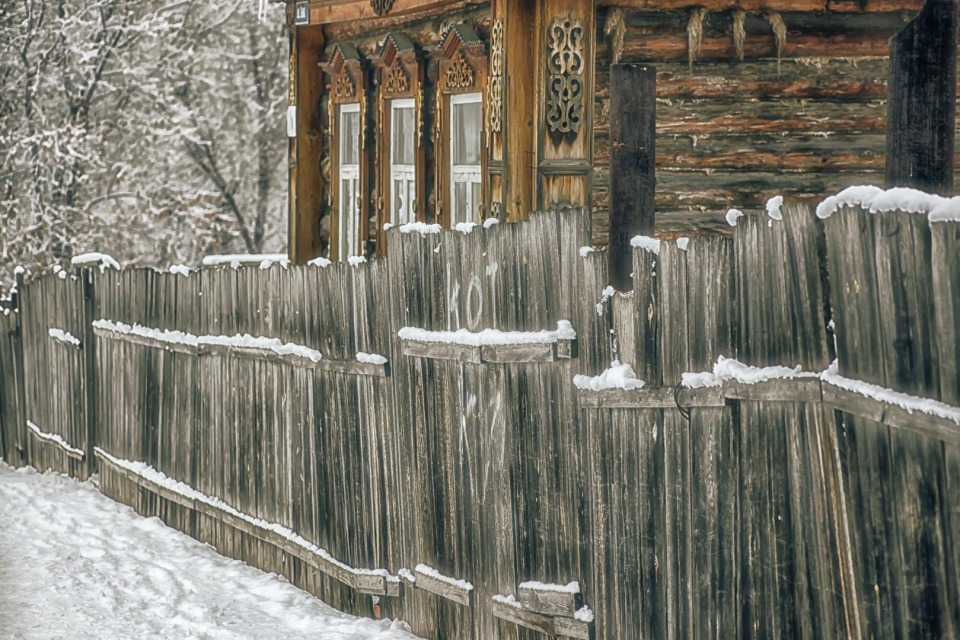 Inscription "cat" on the wooden fence